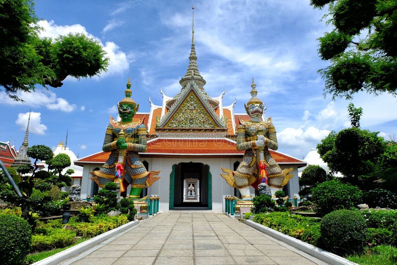 Ancient Guardian Giants in Front of Wat Arun Entrance, Bangkok Thailand.