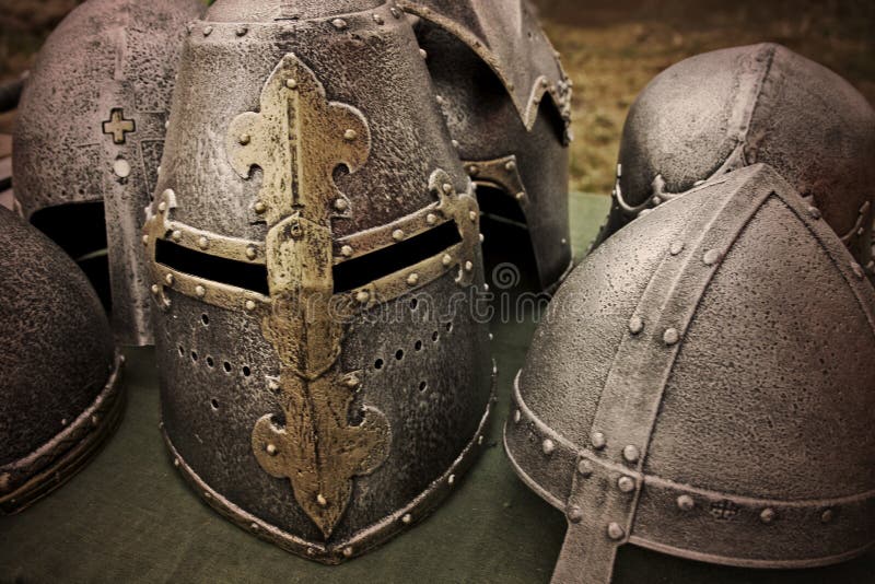Ancient knight helmets on the table stock images