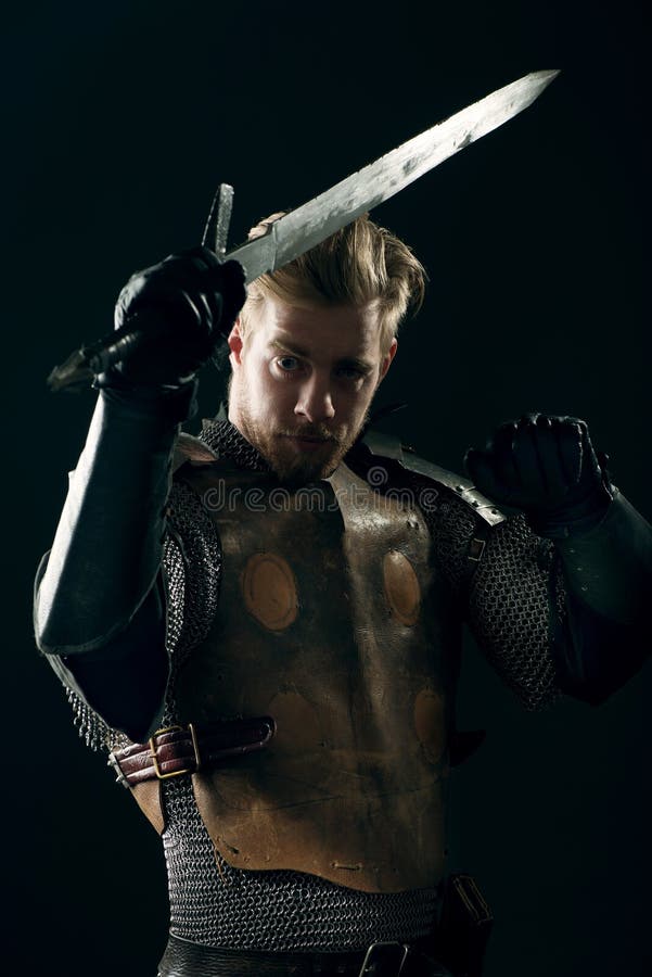 Ancient knight in metal armor royalty free stock photography