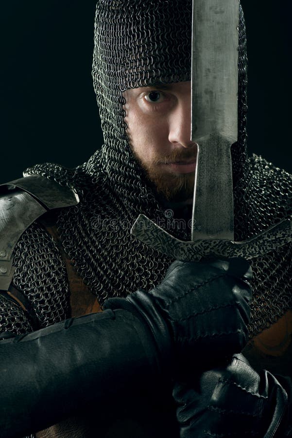 Ancient knight in metal armor stock images