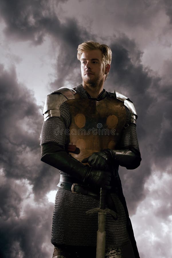 Ancient knight in metal armor stock images