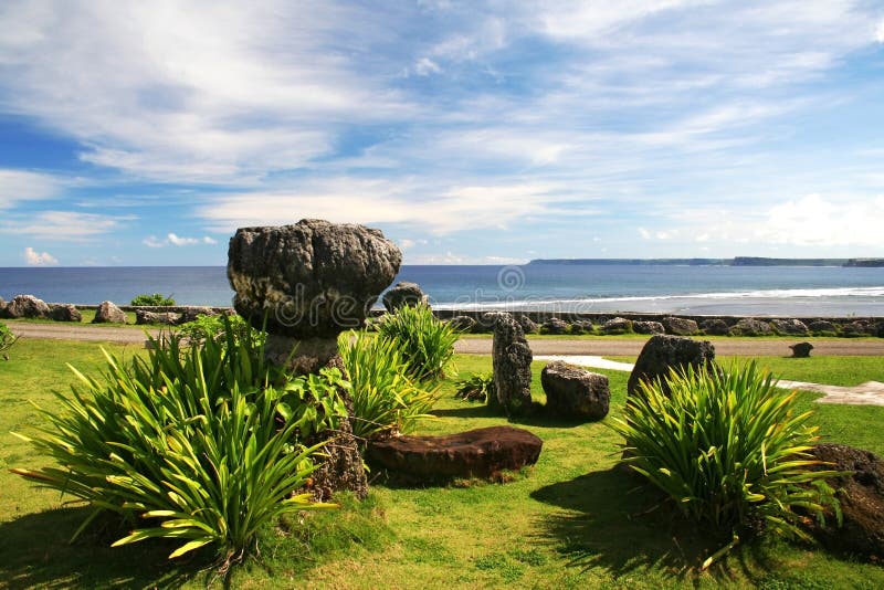 Ancient Latte stones behind the governor's mansion in Guam with the ocean in the background. Ancient Latte stones behind the governor's mansion in Guam with the ocean in the background