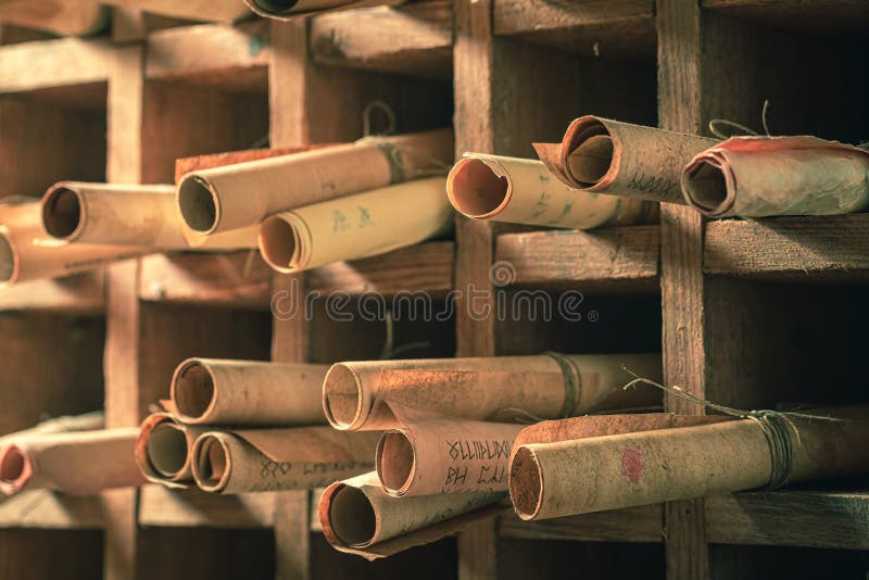 Ancient library full of valuable manuscripts in wooden box royalty free stock photography
