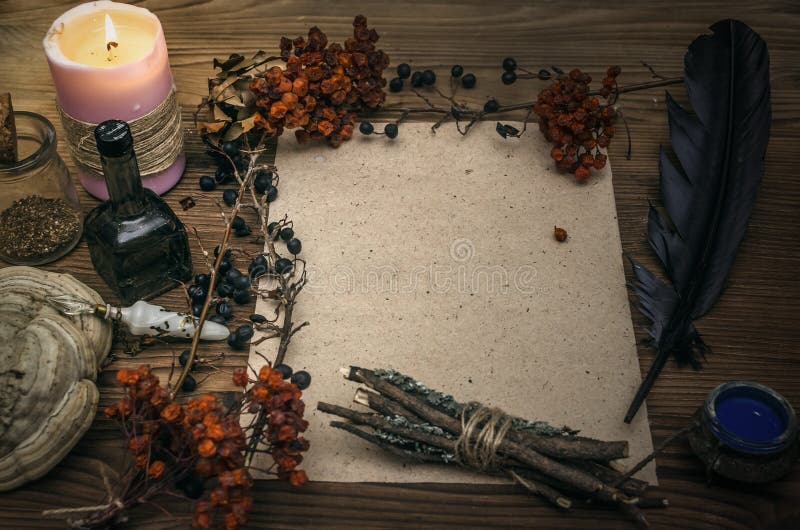 Witchcraft background with copy space. Magic potions and dried herbs on a  witch doctor table. Stock Photo