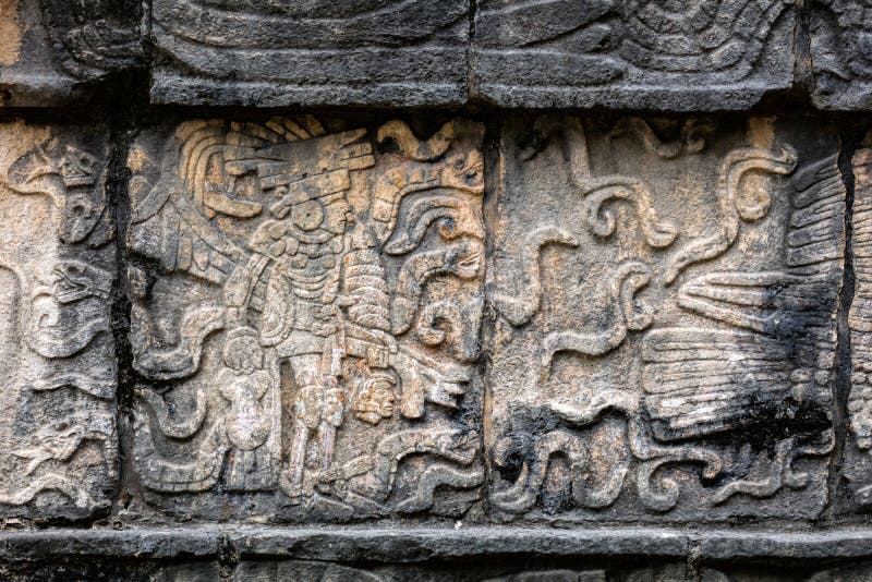 Ancient Mayan mural depicting a warrior holding a human head