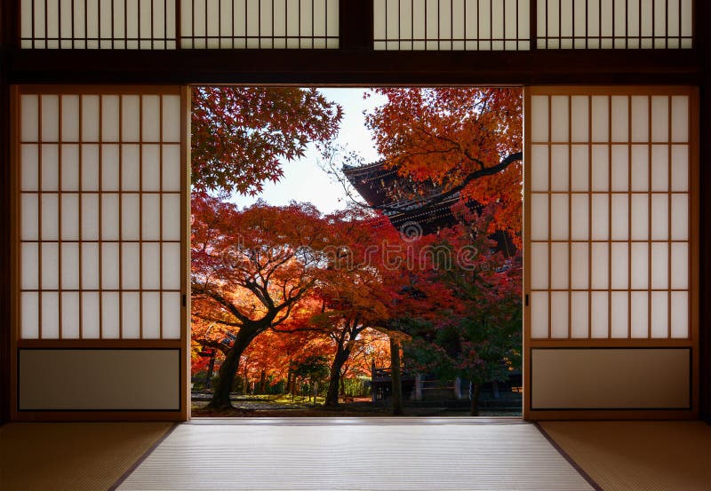 Ancient pagoda and beautiful red fall maples seen through a traditional Japanese doorway in autumn royalty free stock photography Ancient pagoda and beautiful red fall maples seen through a traditional Japanese doorway in autumn royalty free stock photography