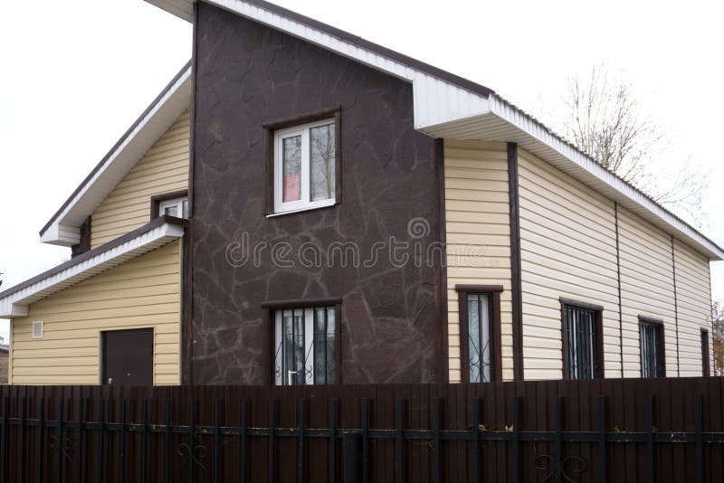 Ancient reconstruction of the street in the House, stand with retro posters, bench, road.