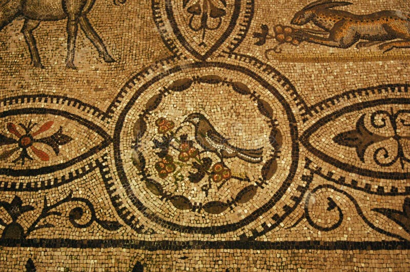 Ancient roman bird eating berries in a tree