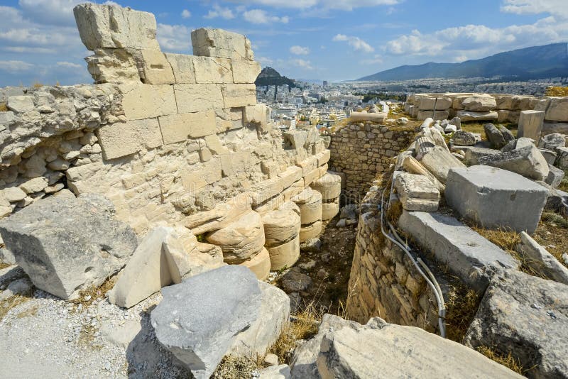 Ancient ruins near the Parthenon on Acropolis Hill with Lykavittos Hill in the distance, in Athens, Greece stock photos Ancient ruins near the Parthenon on Acropolis Hill with Lykavittos Hill in the distance, in Athens, Greece stock photos