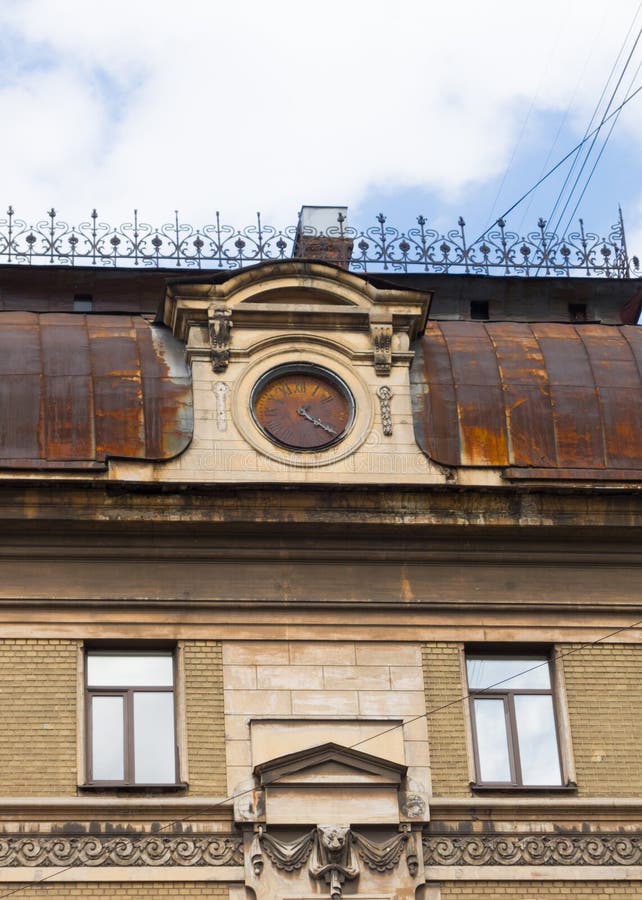 Ancient rusty clock at roof royalty free stock photo