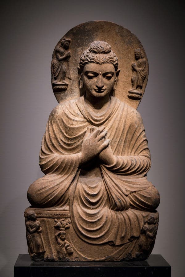 Ancient seated Buddha schist statue image in 2nd-3rd century, Kushan dynasty from Gandhara, Pakistan