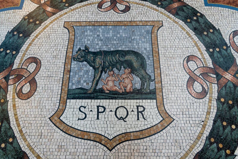 Ancient SPQR mosaics sign in Vittorio Emanuele Gallery in Milan, Italy.