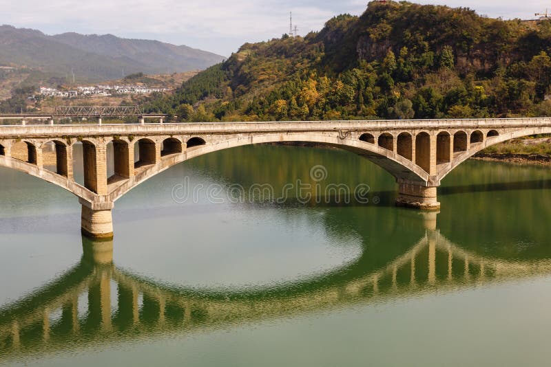 Ancient stone bridge over the Bailong River stock images