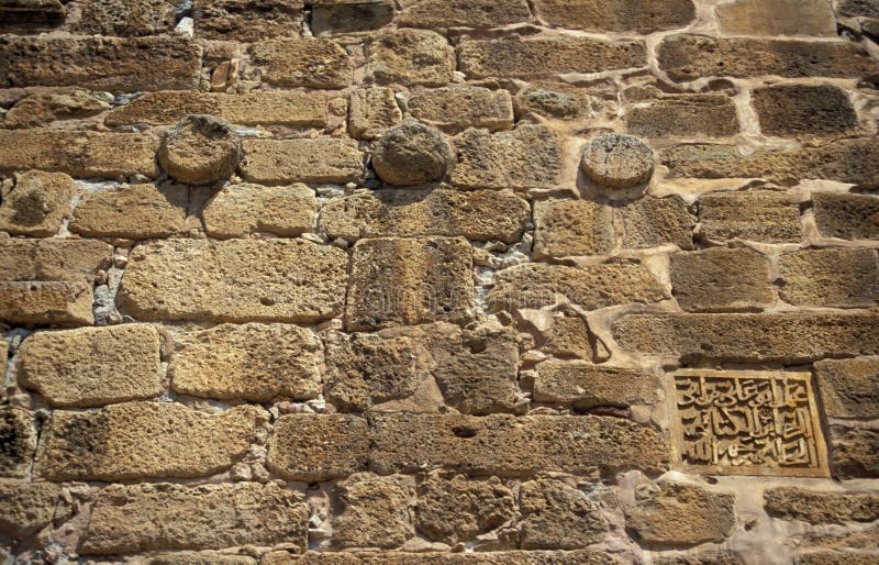 Old city wall with inscription in Alanya resort in Turkey royalty free stock photos.