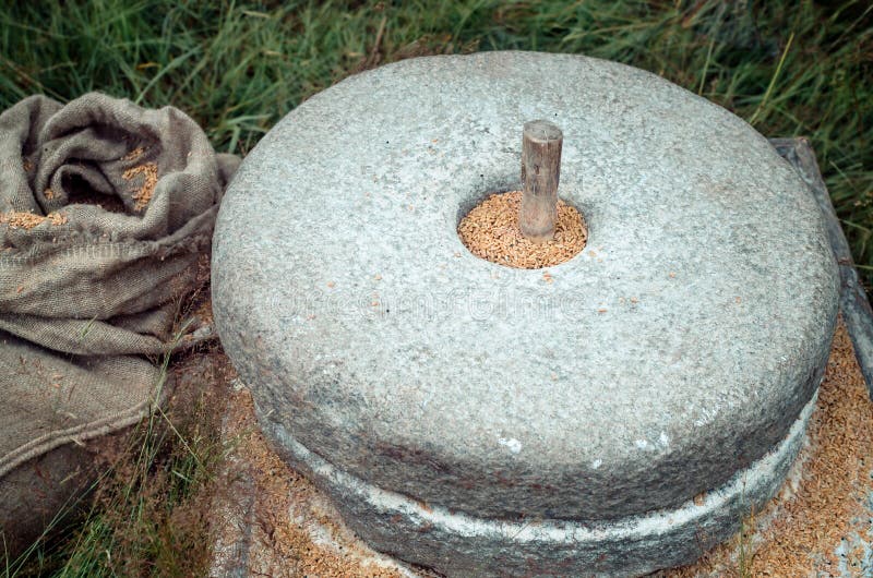 The Ancient Stone Hand Mill with Grain Stock Photo Image of antique