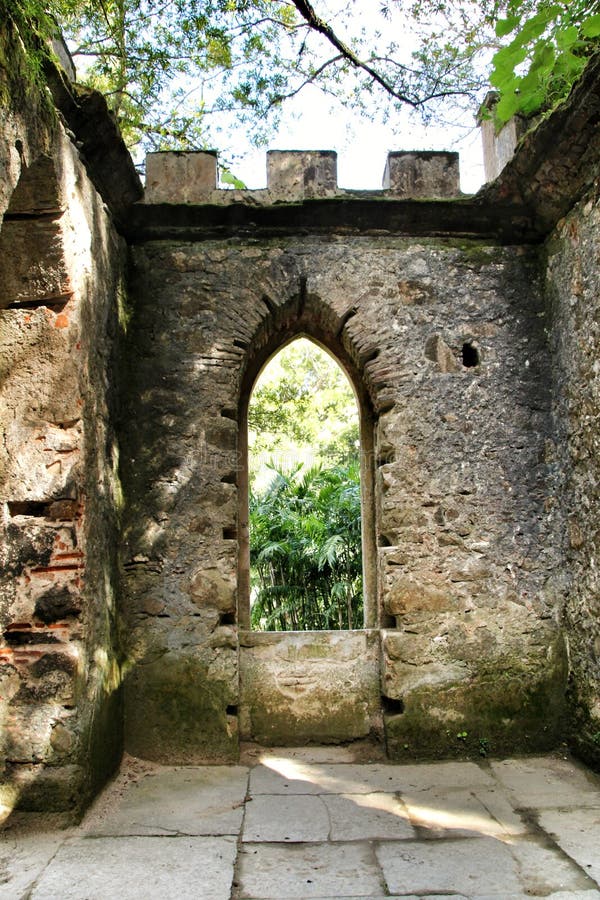 Ancient stone ruins in a leafy garden of Sintra