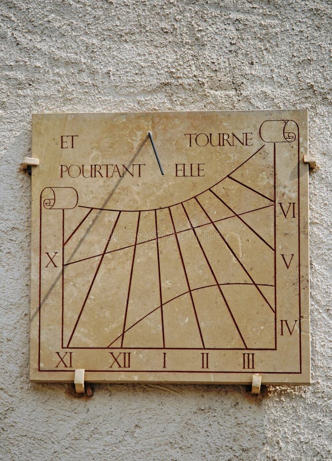 Ancient sundial or sun clock on a wall