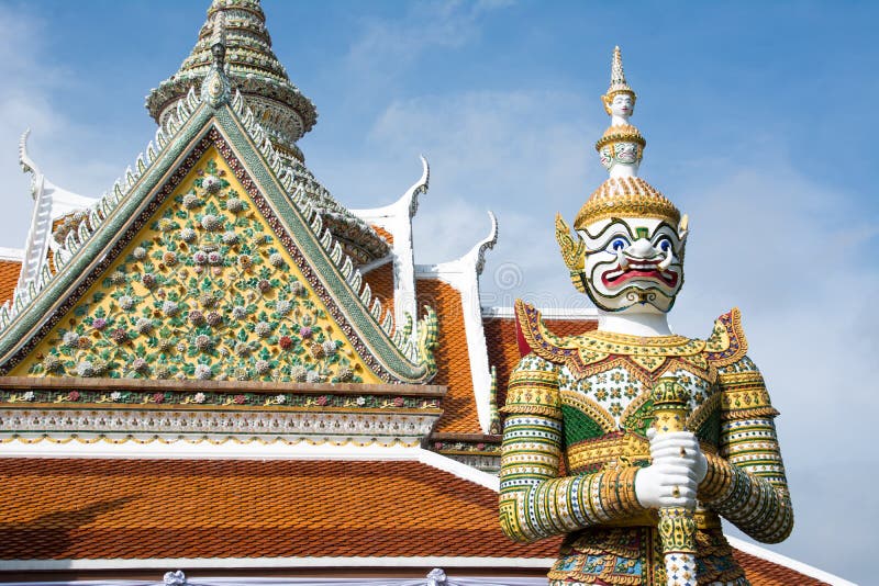 Ancient temple guardian in front of Temple of Dawn Wat Arun Buddhist Temple is white demon giant statue named Sahatsadecha.