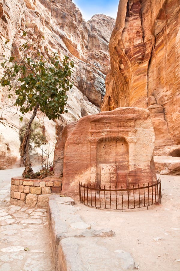 Ancient tomb in canyon Siq, Petra