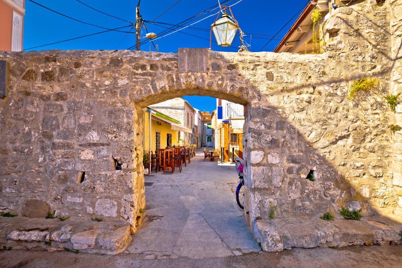 Ancient village of Sukosan near Zadar stone street and arch gate