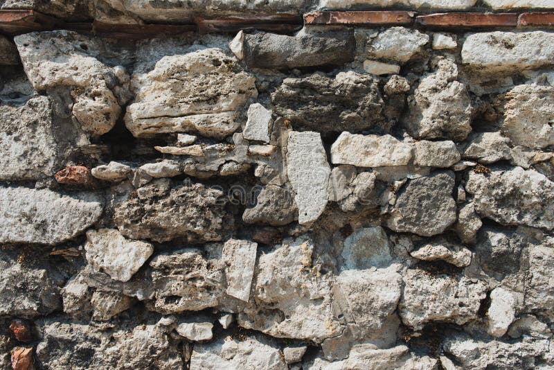 Ancient wall made of stones texture. Medieval surface. stock photos