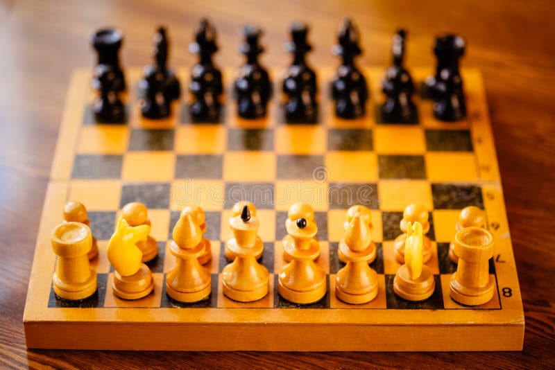 Ancient wooden chess pieces on an old chessboard Stock Photo - Alamy