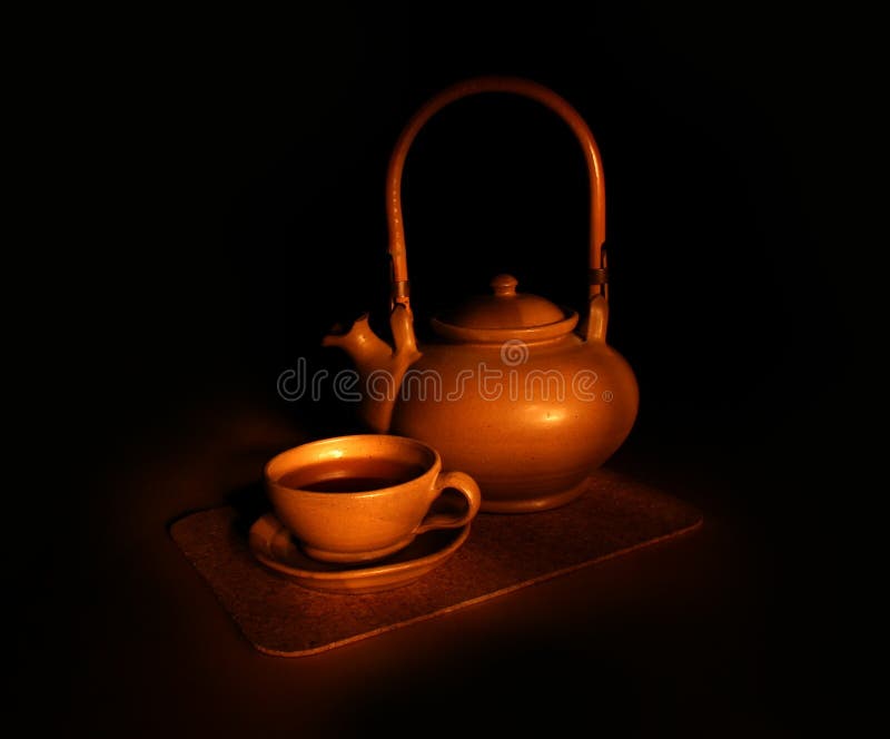 Evening tea still-life - dark background. Evening tea still-life - dark background