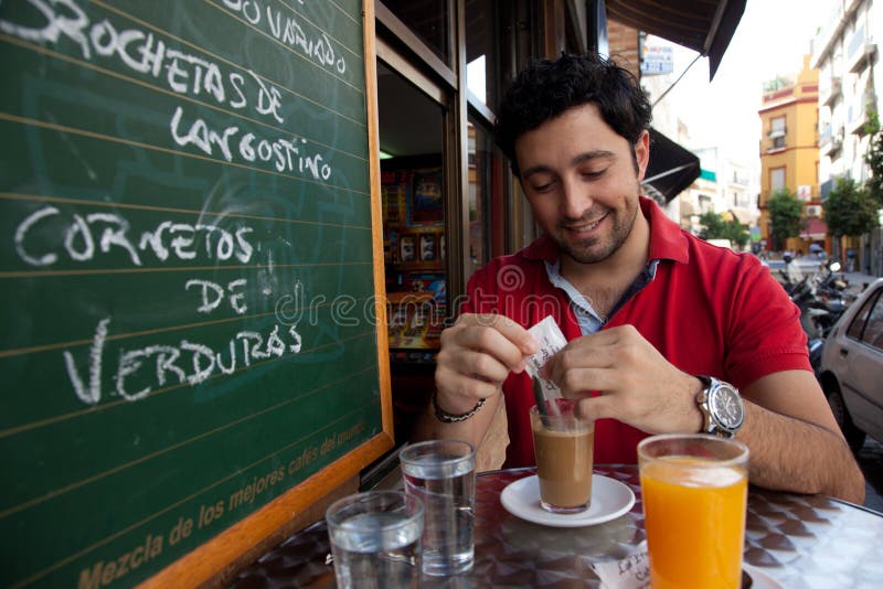 Andalusian young man having breakfast