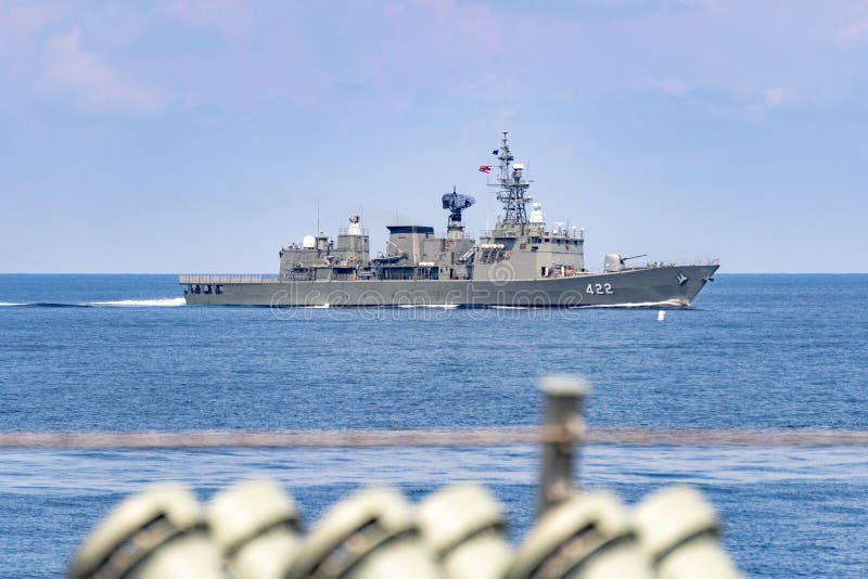 ANDAMAN SEA, THAILAND - APRIL 12, 2019 : HTMS Taksin FFG422 Guided missile frigate of Royal Thai Navy sails in the sea during Annual sea training. ANDAMAN SEA, THAILAND - APRIL 12, 2019 : HTMS Taksin FFG422 Guided missile frigate of Royal Thai Navy sails in the sea during Annual sea training.