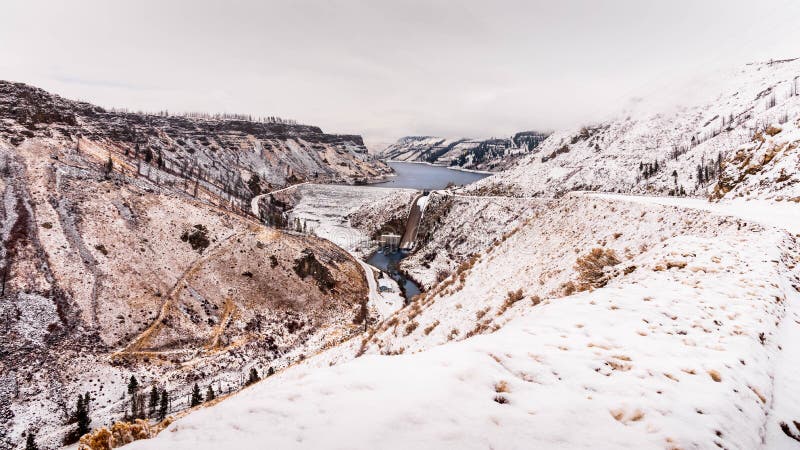 Anderson Ranch Dam in the winter on the South Fork of the Boise River in Idaho. View from above of Anderson Ranch Dam in the winter, covered with snow, located stock photo Anderson Ranch Dam in the winter on the South Fork of the Boise River in Idaho. View from above of Anderson Ranch Dam in the winter, covered with snow, located stock photo