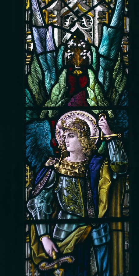 Detail of victorian stained glass church window in Fringford depicting a typical victorian angel with a sword in his hands. Detail of victorian stained glass church window in Fringford depicting a typical victorian angel with a sword in his hands