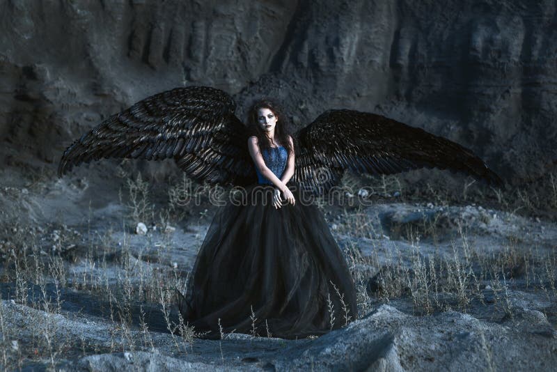 Angel with black wings stock photos Angel with black wings stock photos