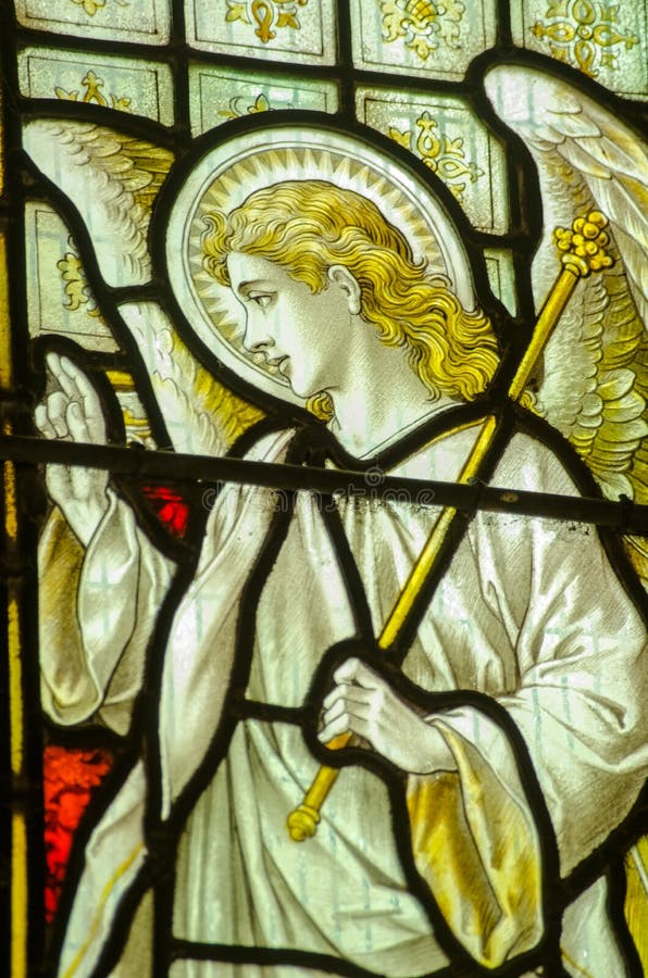 Victorian stained glass window showing the Angel Gabriel at the Annunciation. Historic window on public display over 100 years. Victorian stained glass window showing the Angel Gabriel at the Annunciation. Historic window on public display over 100 years.