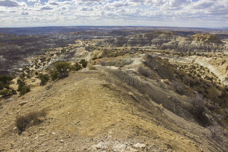 A landscape of the BLM Angel Peak Scenic Area in northwestern New Mexico. This BLM area showcases colorful desert badlands. A landscape of the BLM Angel Peak Scenic Area in northwestern New Mexico. This BLM area showcases colorful desert badlands.