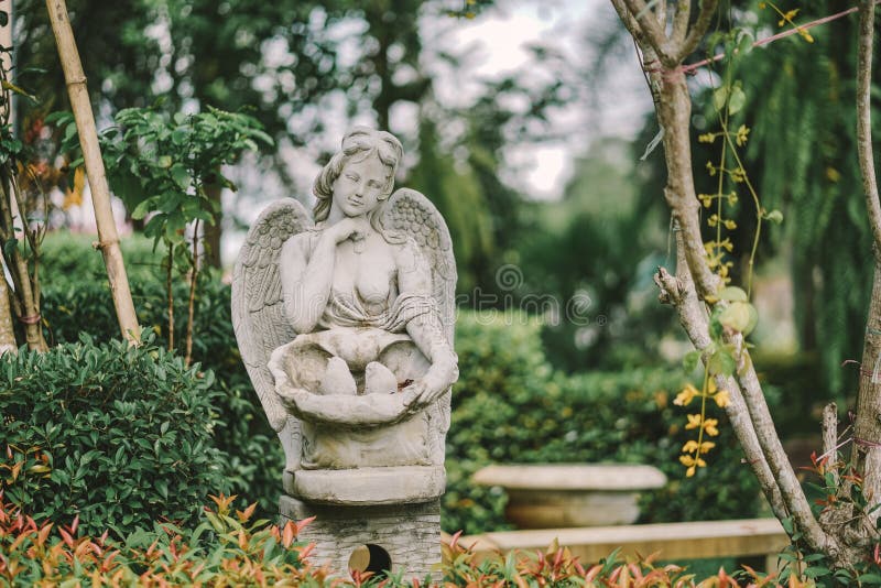 Angel statue. A classical Roman style of lady angel with wings decoration in the public garden royalty free stock photos Angel statue. A classical Roman style of lady angel with wings decoration in the public garden royalty free stock photos