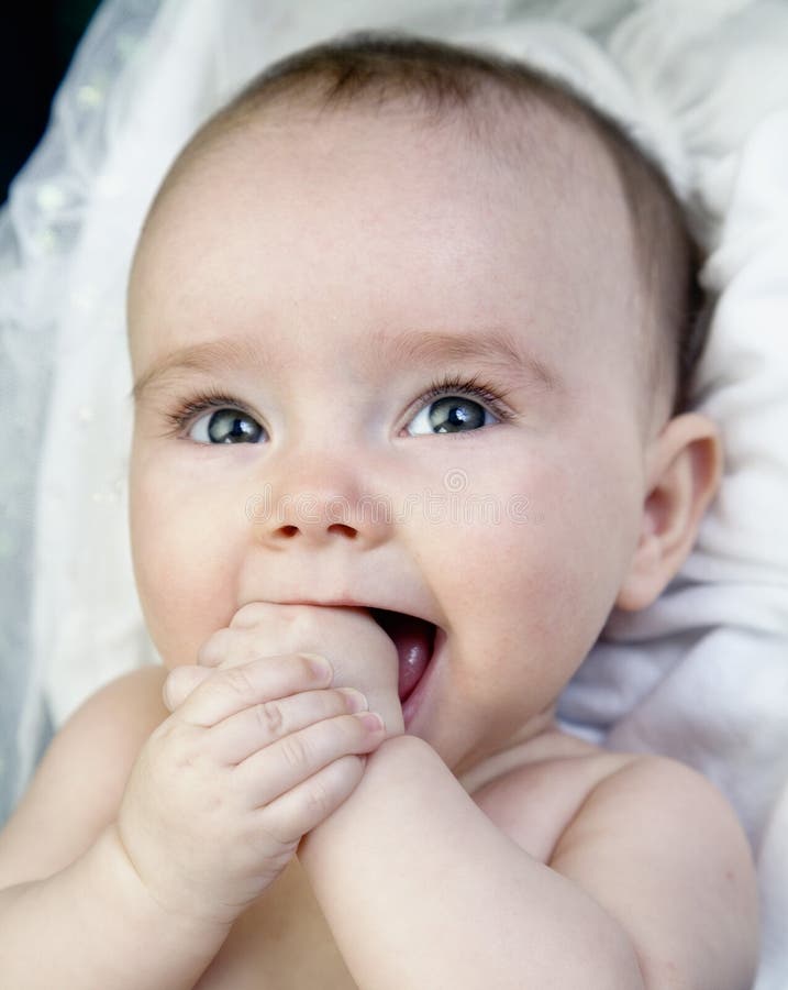 Angelic Baby with Hand in Mouth Stock Photo Image of adorable, joyful