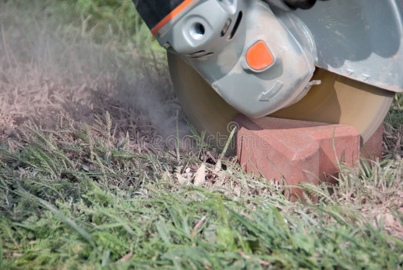 Worker working with angle grinder cutting tile in half. Bricklayer tiler stock images, royalty-free photos and pictures
