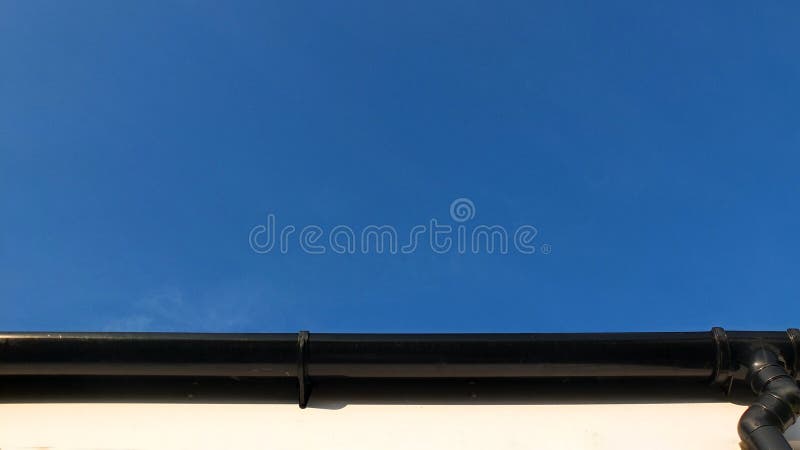 Repeated architectural features creating a geometric pattern, white render, blue sky with black outlined. Repeated architectural features creating a geometric pattern, white render, blue sky with black outlined