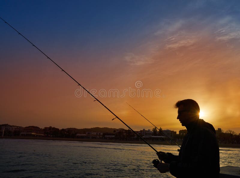 Angler with spinning rod fishing in Mediterranean royalty free stock photo
