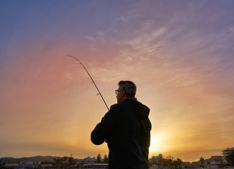 Angler with spinning rod fishing in Mediterranean stock photos