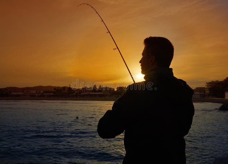 Angler with spinning rod fishing in Mediterranean stock image