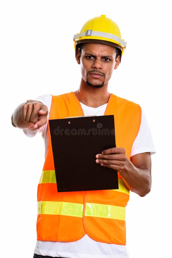 Angry African man construction worker holding clipboard while po royalty free stock photos Angry African man construction worker holding clipboard while po royalty free stock photos