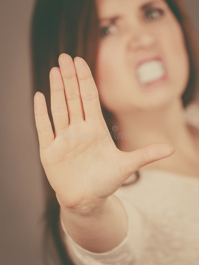 Angry apodicticity woman showing stop with hand royalty free stock image Angry apodicticity woman showing stop with hand royalty free stock image