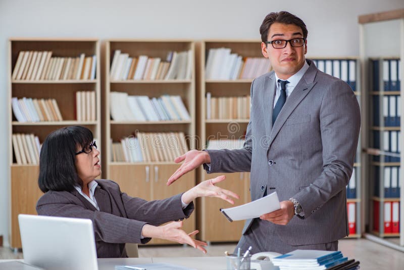 The angry boss reprimanding fellow employee royalty free stock image