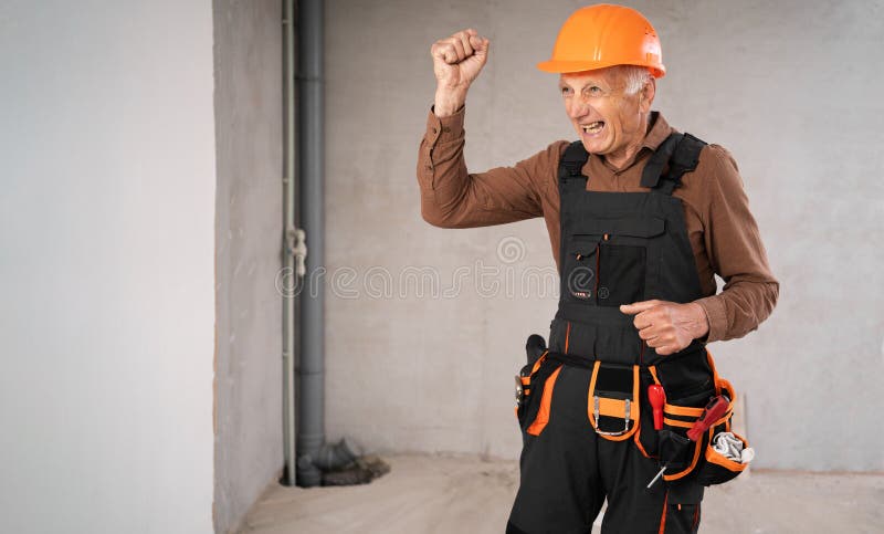Angry builder worker shouting and waving fist. Construction site concept royalty free stock photo