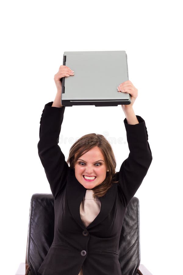 Angry businesswoman throwing her laptop royalty free stock photography