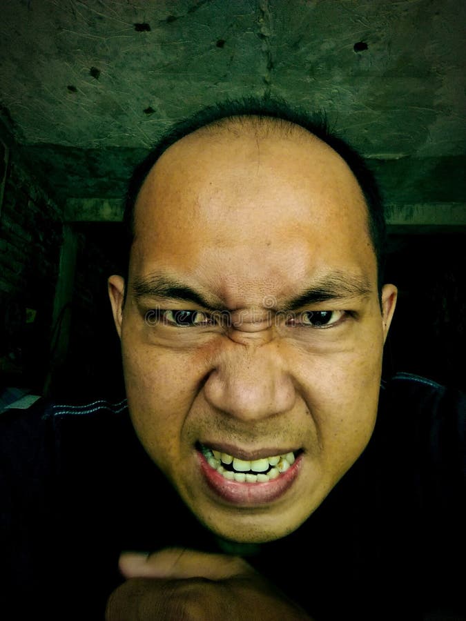 Angry face expression asian man,close up shot stock image Angry face expression asian man,close up shot stock image