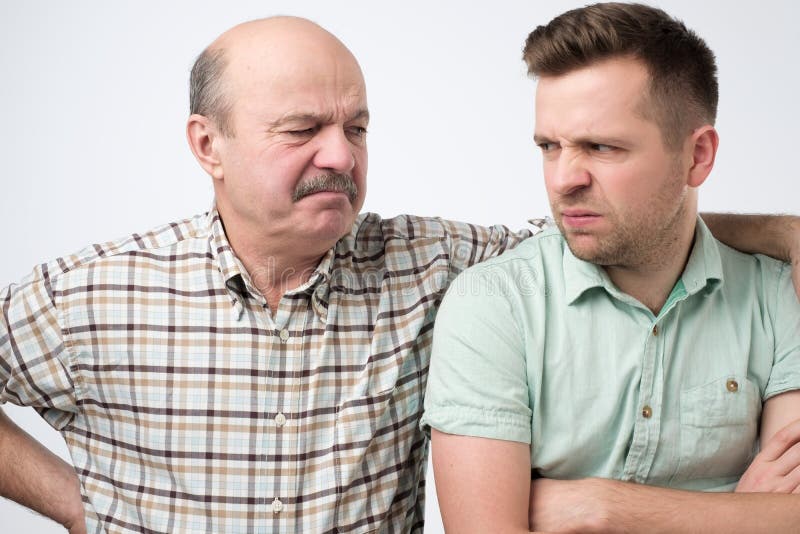 Angry father and son having an argument stock images Angry father and son having an argument stock images
