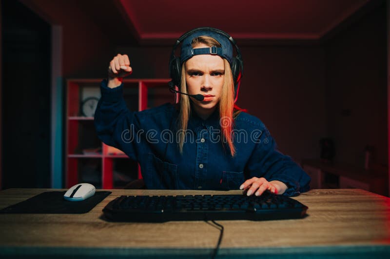 Teenage Couple With Headphone Play Game Online At Home Computer. Stock  Photo, Picture and Royalty Free Image. Image 172632258.