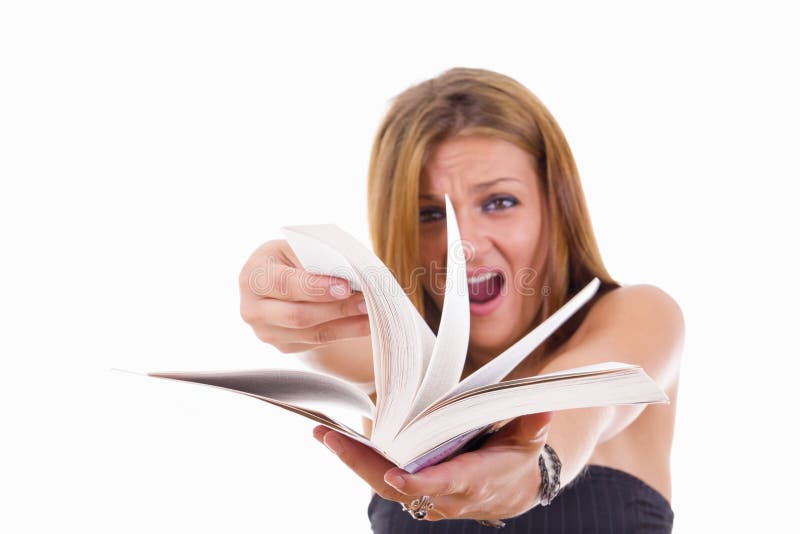 Angry female student flipping a book royalty free stock photo Angry female student flipping a book royalty free stock photo
